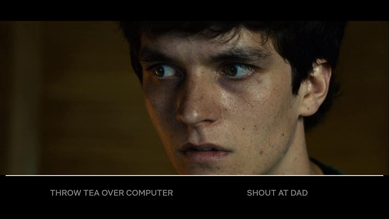 A close-up image of a young dark-haired man looking worriedly to his right, with text underneath showing two options: 'throw tea over computer' or 'shout at dad'.