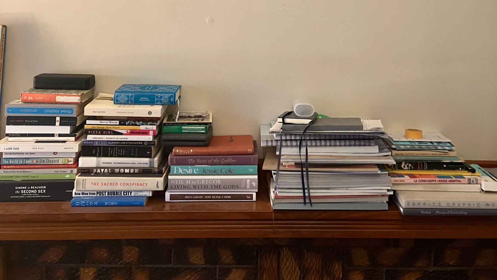 Books on a mantlepiece.